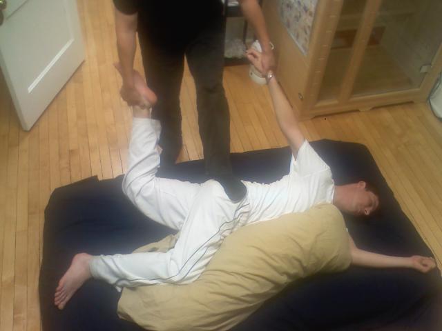 Thai_massage_cross_body_stretch.jpg