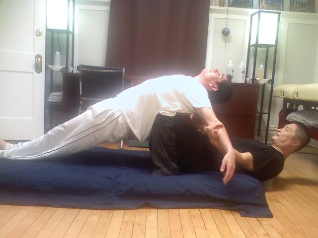 Thai_massage_iron_cross.jpg