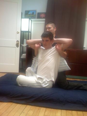 Thai_massage_sitting_spinal_torsion.jpg